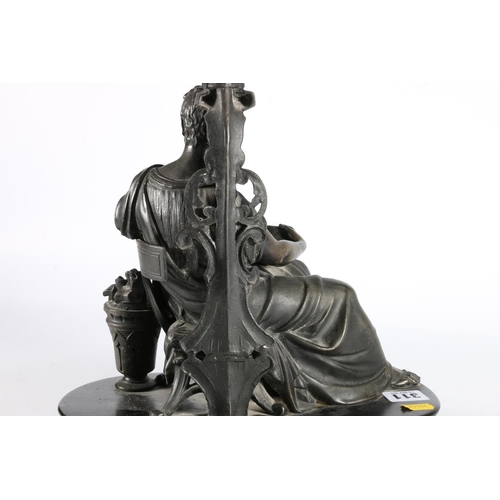 311 - Cast metal figure of a Roman or Greek classical figure positioned sat reading a scroll, upon ebonise... 