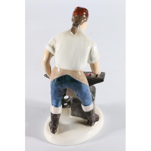 354 - Royal Doulton figurine HN2240 The Blacksmith of Williamsburg, 18cm tall.