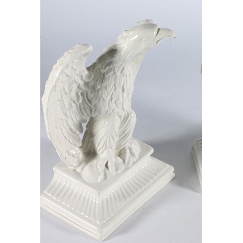 364 - Pair of white glazed porcelain eagles, 22cm tall. (2)