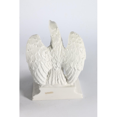 364 - Pair of white glazed porcelain eagles, 22cm tall. (2)