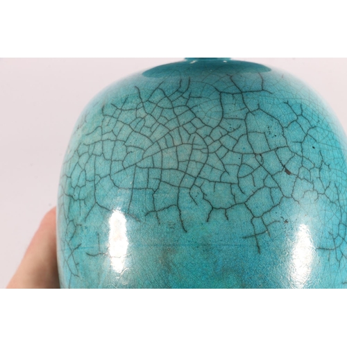 378 - Oriental style turquoise glazed raku fired vase, 19cm tall. 