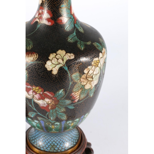 382 - Pair of Chinese cloisonné enamel vases raised on carved wood stands, 28cm tall. (2)