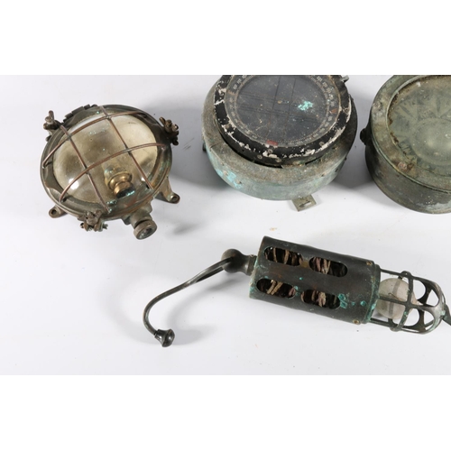 418 - Two ships compasses, a inspection lantern and an electric lamp. (4)