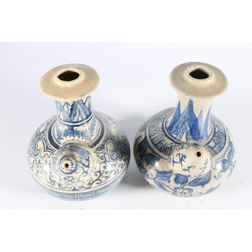 454 - Two blue and white pottery kendi vessels, 18cm tall. (2)