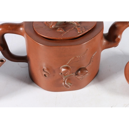 471 - Chinese Jixing terracotta teapot with seal mark to base, another, and a dish. (3)