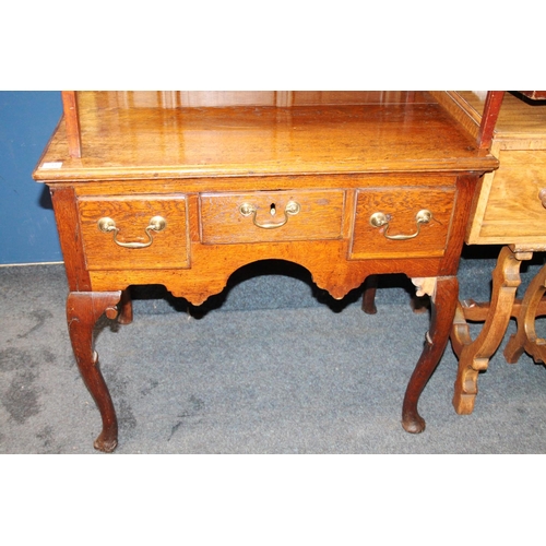 578 - Antique oak lowboy, with two frieze drawers above shaped skirt, raised on cabriole supports, 83 x 55... 