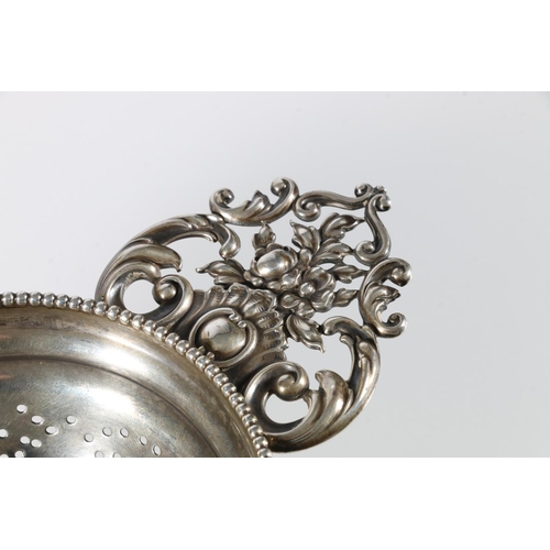 333 - Sterling silver tea strainer, stamped '1259', no makers marks, 79g gross, 19cm across the handles.