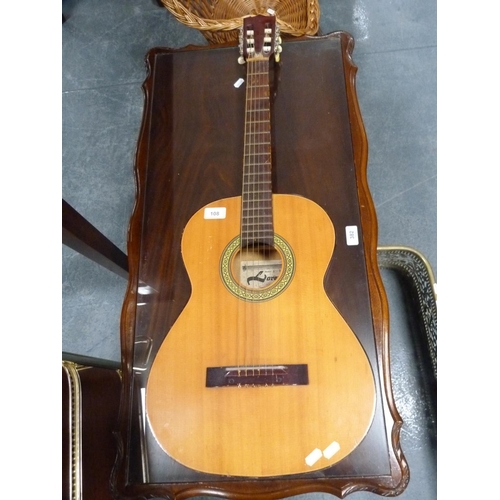 108 - Lorenzo Model N16X acoustic guitar and a Ramon Sanchez steel-strung ukulele.  (2)