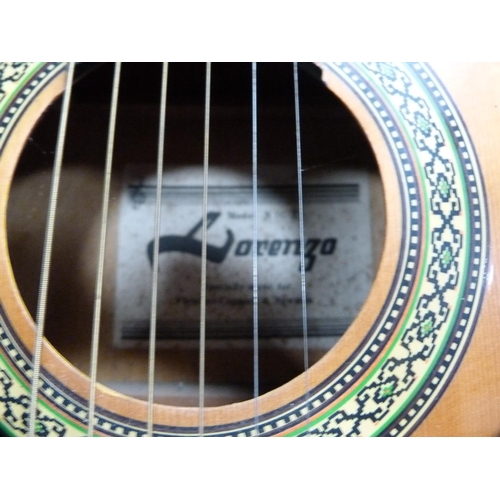 108 - Lorenzo Model N16X acoustic guitar and a Ramon Sanchez steel-strung ukulele.  (2)