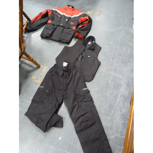 109 - Assorted motorcycling clothing to include Ashman leather jacket, size 46, trousers, and a Pro Bika j... 