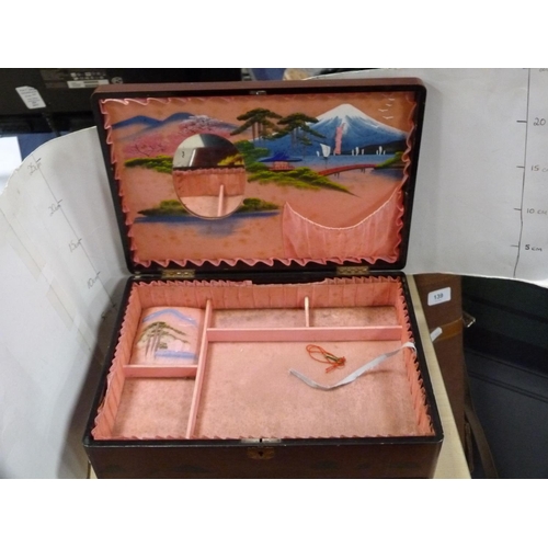 140 - Japanese lacquered sewing box, similar lacquered glove box and a musical jewellery box.  (3)