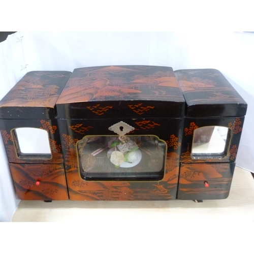 140 - Japanese lacquered sewing box, similar lacquered glove box and a musical jewellery box.  (3)