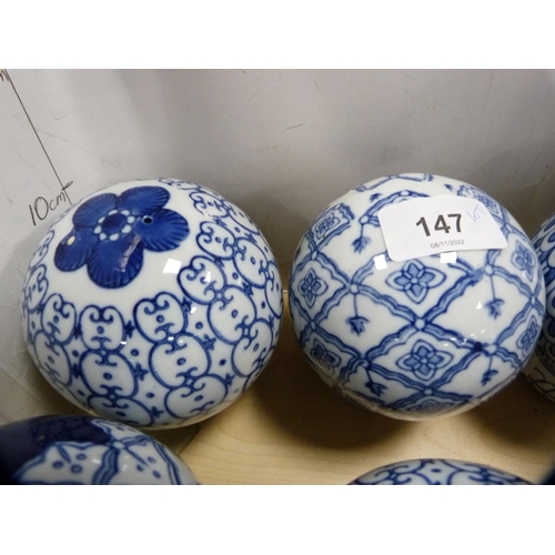 147 - Collection of eight blue and white ceramic bowls with napkin ring stands.