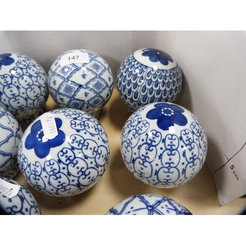 147 - Collection of eight blue and white ceramic bowls with napkin ring stands.