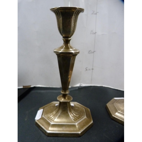 156 - Pair of silver candlesticks.