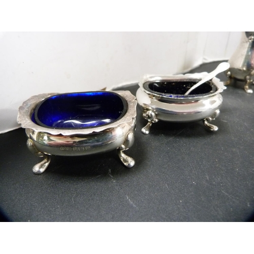 165 - Silver condiments to include mustard pots with blue glass liners, pair of silver pepper pots etc., 1... 