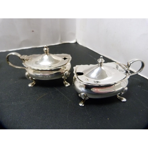 165 - Silver condiments to include mustard pots with blue glass liners, pair of silver pepper pots etc., 1... 