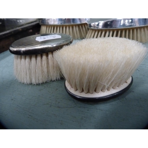 187 - Assorted silver-backed brushes comprising a pair of engine-turned clothes brushes, small pair of eng... 