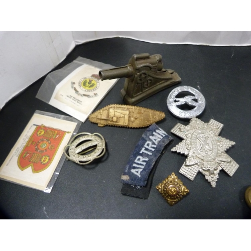 189 - Collection of military collectables to include buttons, clan badge, metal cannon ornament, cloth ATC... 