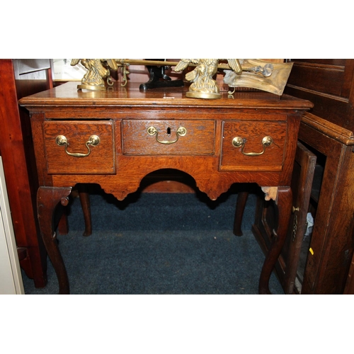 578 - Antique oak lowboy, with two frieze drawers above shaped skirt, raised on cabriole supports, 83 x 55... 