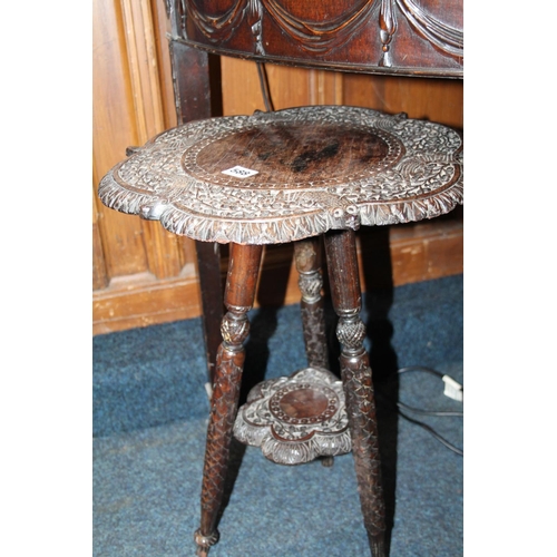 588 - Carved oak two-tier occasional table, with alligator decoration, 57cm high.