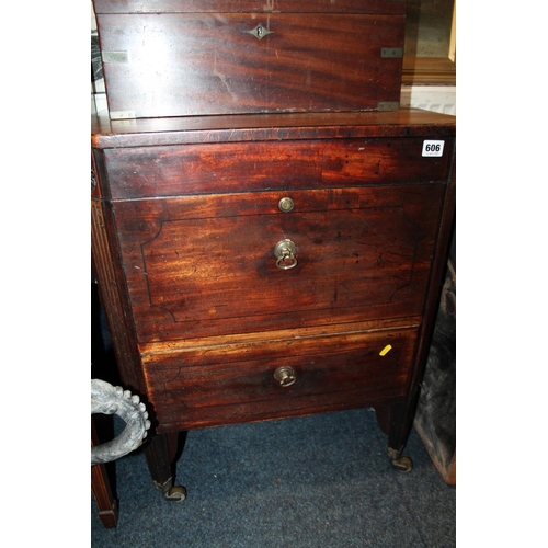 606 - Georgian mahogany wine cooler, with carved and fluted legs, raised on brass castors.