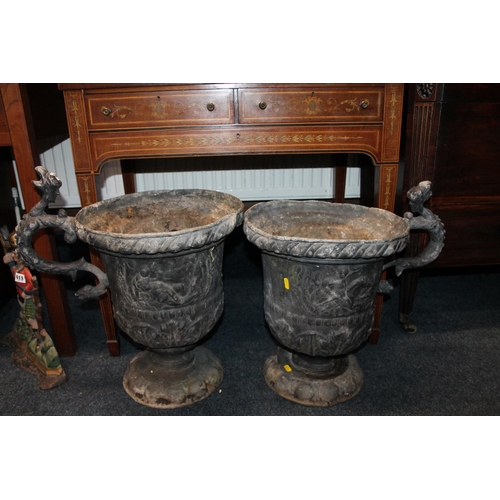 608 - Pair of Georgian lead garden urns, with s-scroll handles and mythological creatures, 54cm high.