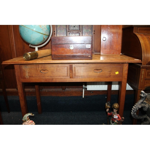 609 - Oak desk with two frieze drawers, on square supports, 106cm wide.