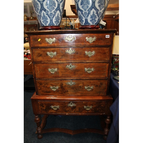 628 - 18th century walnut four drawer chest on stand, with shaped base on bun feet, 125cm high.