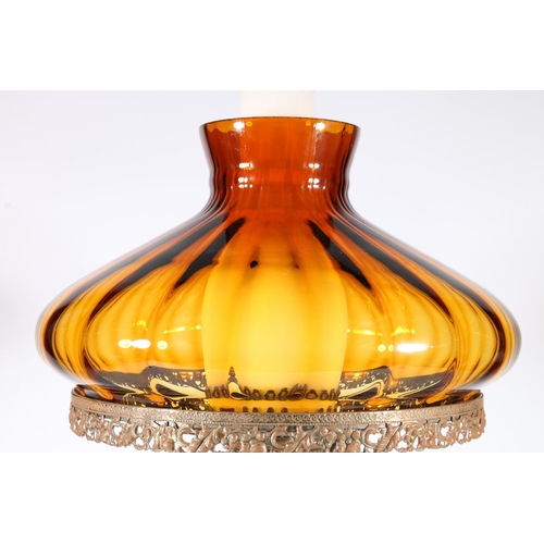 324 - Antique style paraffin lamp converted to an electric table lamp with amber coloured glass shade, rai... 