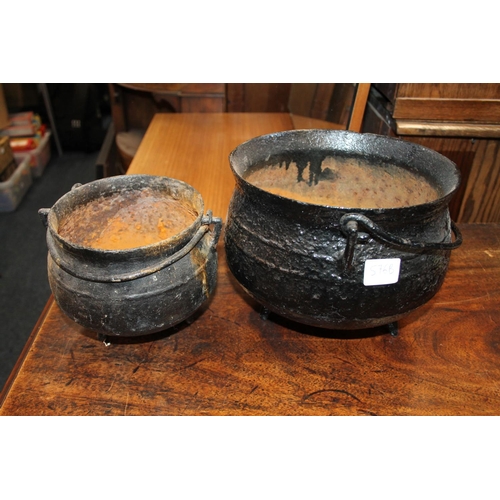 576B - Cast iron swing-handled cauldron, and another.  (2)