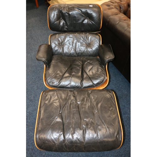 636 - Charles & Ray Eames style lounge chair and swivel footstool.