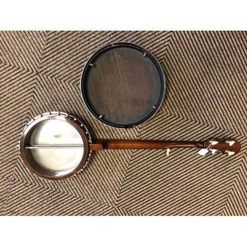 264 - A Saga 5 string Banjo, with Saga in mother of pearl on headstock, overall length 97 cm in lined and ... 