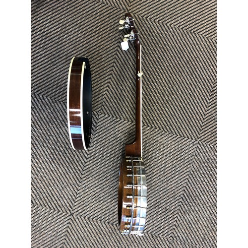 264 - A Saga 5 string Banjo, with Saga in mother of pearl on headstock, overall length 97 cm in lined and ... 