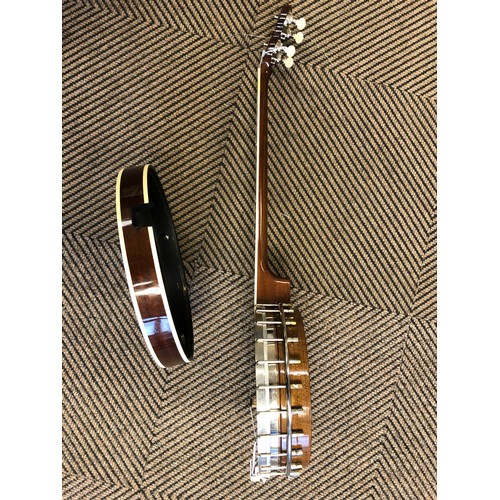 264 - A Saga 5 string Banjo, with Saga in mother of pearl on headstock, overall length 97 cm in lined and ... 