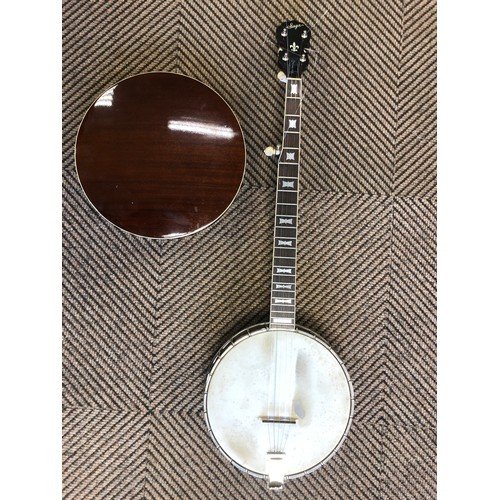 264 - A Saga 5 string Banjo, with Saga in mother of pearl on headstock, overall length 97 cm in lined and ... 