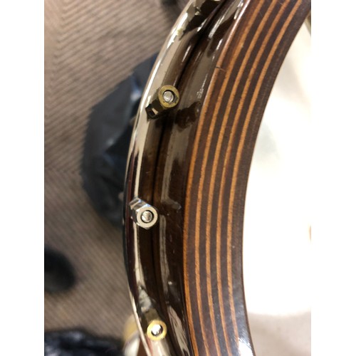 264 - A Saga 5 string Banjo, with Saga in mother of pearl on headstock, overall length 97 cm in lined and ... 