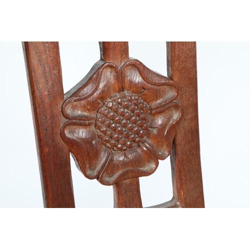 450 - Robert Mouseman of Kilburn oak monks chair, the curved back rail with a carved monks head to either ... 
