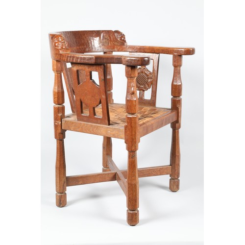 450 - Robert Mouseman of Kilburn oak monks chair, the curved back rail with a carved monks head to either ... 