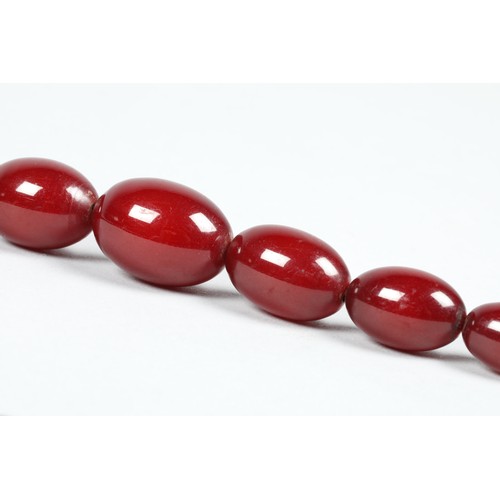 112 - Cherry amber bead necklace, length 67cm, largest bead 25mm, total weight 44g