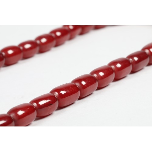 113 - Cherry amber bead necklace, length 75cm, largest bead 21mm, total weight 70g