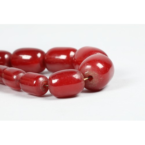 113 - Cherry amber bead necklace, length 75cm, largest bead 21mm, total weight 70g