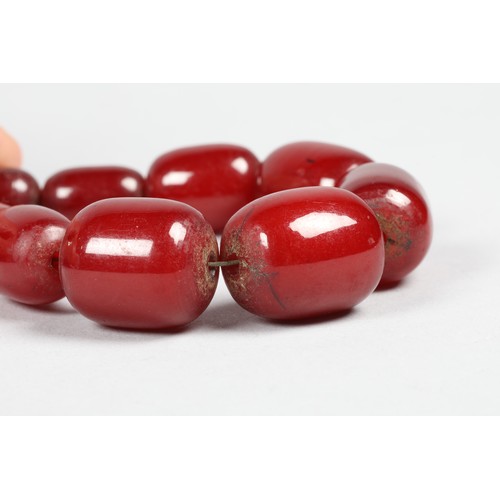 113 - Cherry amber bead necklace, length 75cm, largest bead 21mm, total weight 70g