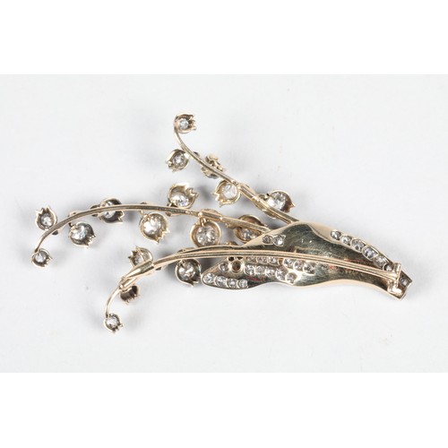 79 - Diamond floral brooch, unmarked metal set with graduated old cut diamonds, ranging from 0.33 carats ... 