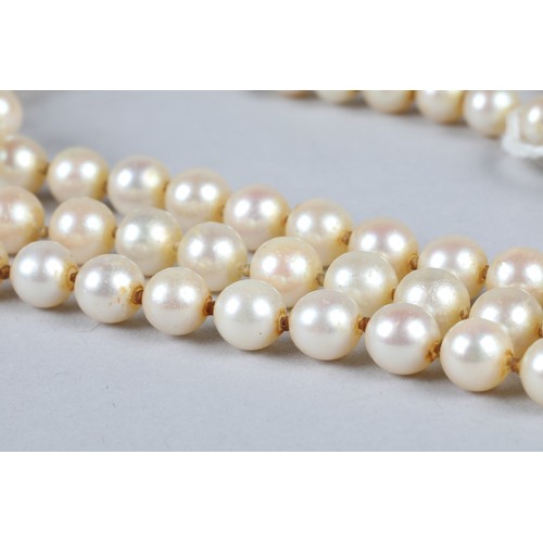 116 - Ladies double strand pearl necklace, with white metal diamond set clasp, 0.33 carats