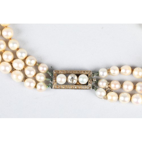 116 - Ladies double strand pearl necklace, with white metal diamond set clasp, 0.33 carats