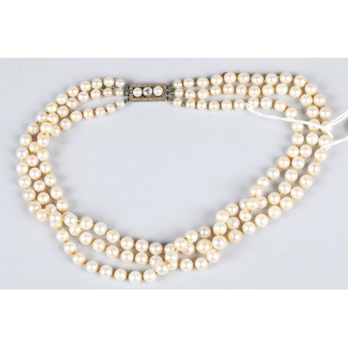 116 - Ladies double strand pearl necklace, with white metal diamond set clasp, 0.33 carats