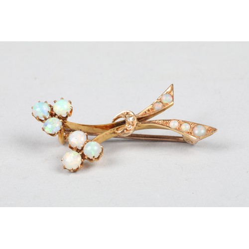 68 - 15 carat gold opal brooch of stylised floral form, length 36mm, weight 3g