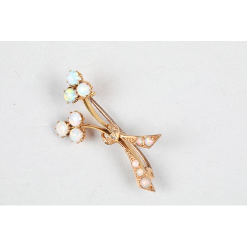 68 - 15 carat gold opal brooch of stylised floral form, length 36mm, weight 3g