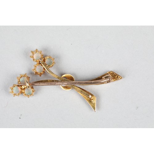 68 - 15 carat gold opal brooch of stylised floral form, length 36mm, weight 3g